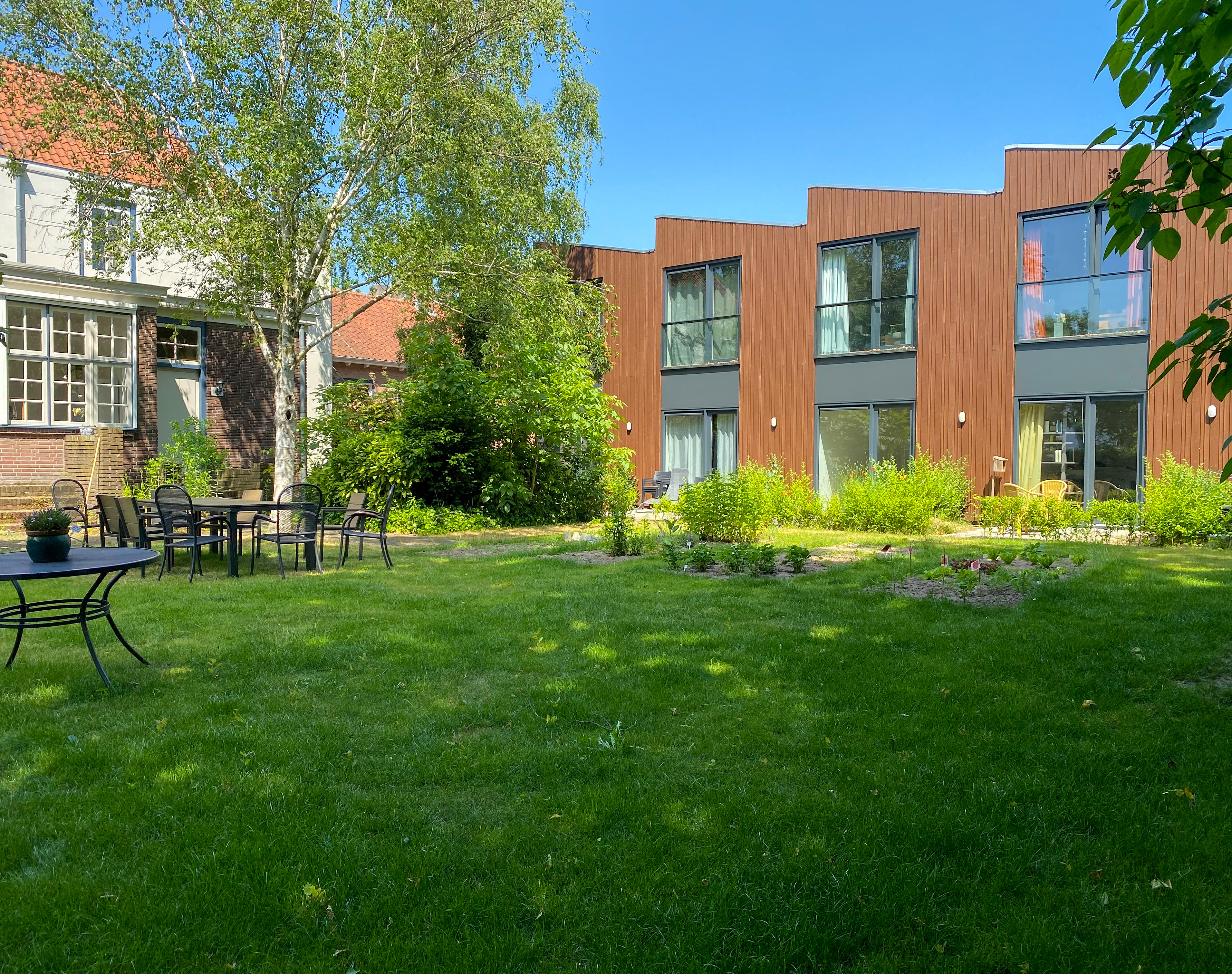 Gezamenlijke tuin en tiny houses